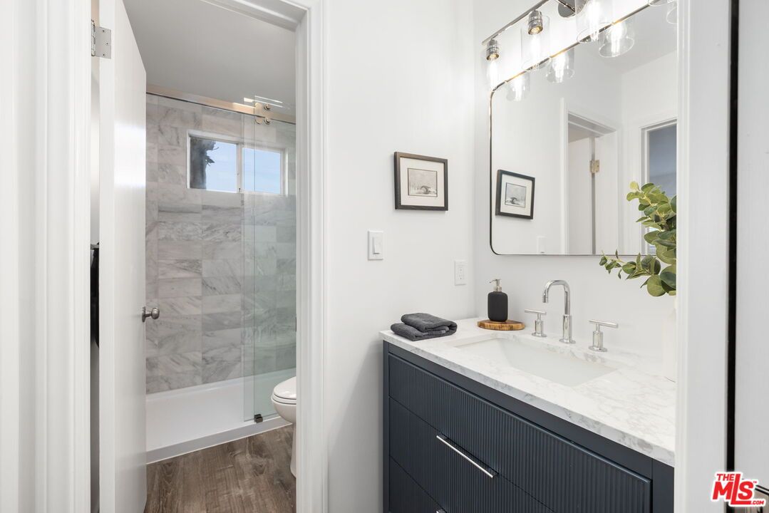 Bathroom, Glass Shower, Interior, Marble Walls, Wood Texture Flooring