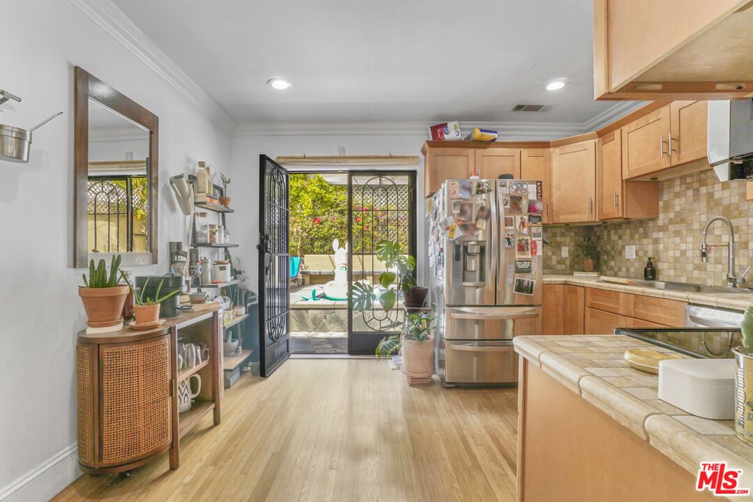 Interior, Kitchen, Recessed Lighting, Stainless Steel Appliances, Tile Countertops, Wood Texture Flooring