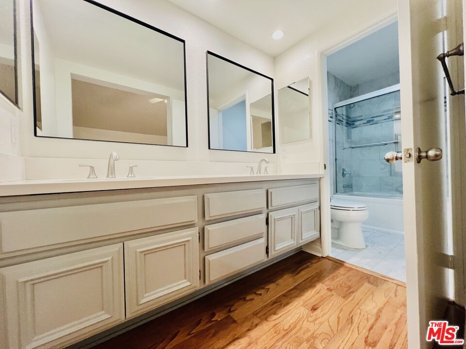 Bathroom, Dual Sink Vanities, Interior, Recessed Lighting, Wood Texture Flooring