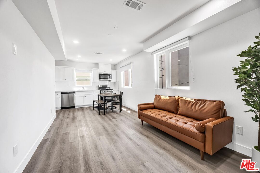 Dining room, Interior, Kitchen, Recessed Lighting, Stainless Steel Appliances, Wood Texture Flooring