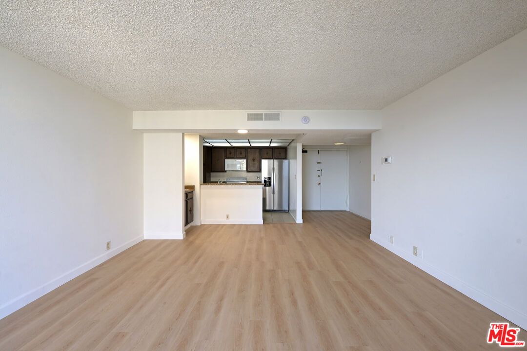 Empty room, Interior, Kitchen, Stainless Steel Appliances, Wood Texture Flooring