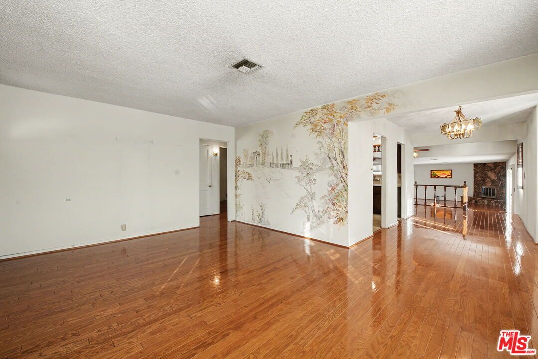 Chandelier, Empty room, Fireplace, Interior, Marble Walls, Wood Texture Flooring
