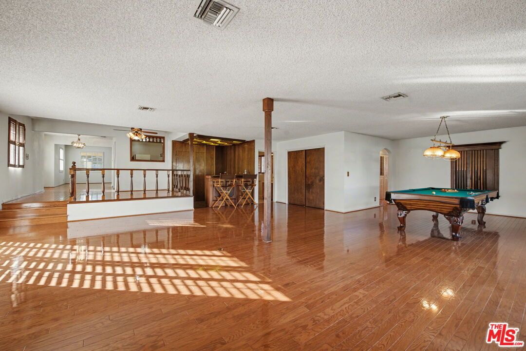 Billiard Table, Fireplace, Game Room, Interior, Pendant Lights, Wood Texture Flooring
