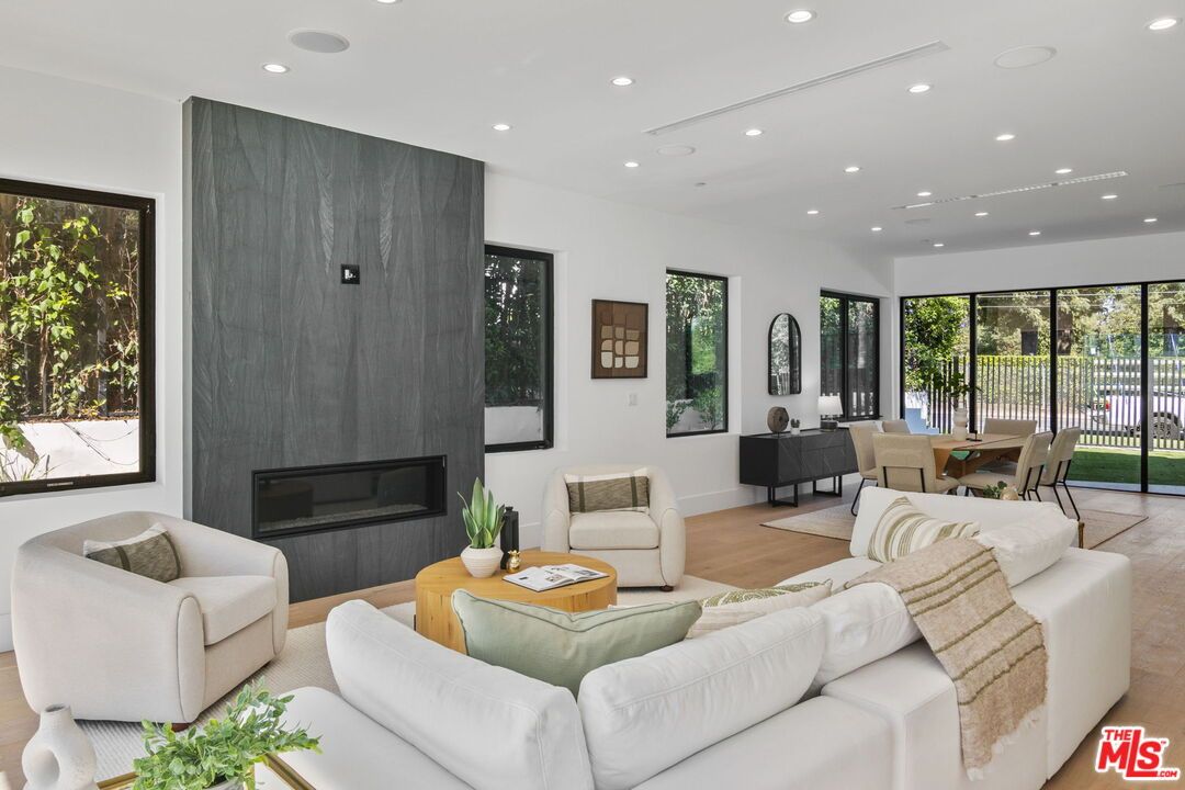 Dining room, Fireplace, Interior, Living room, Recessed Lighting, Wood Texture Flooring