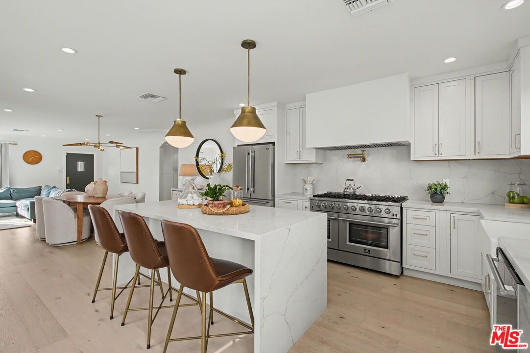 Interior, Kitchen, Living room, Marble Walls, Pendant Lights, Recessed Lighting, Stainless Steel Appliances, Wood Texture Flooring