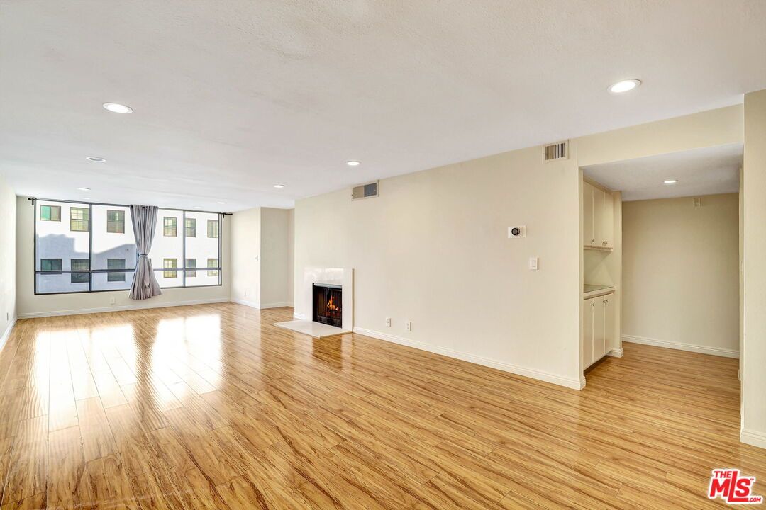 Empty room, Fireplace, Interior, Recessed Lighting, Wood Texture Flooring