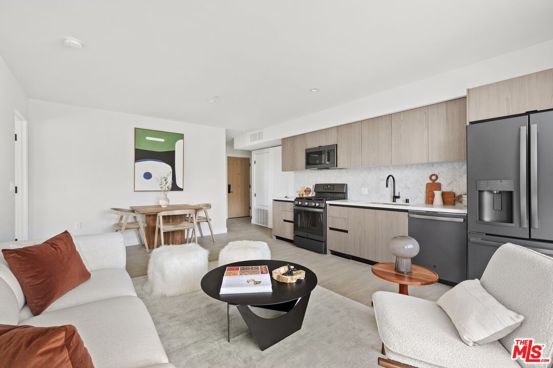 Dining room, Interior, Kitchen, Living room, Recessed Lighting, Stainless Steel Appliances, Wood Texture Flooring