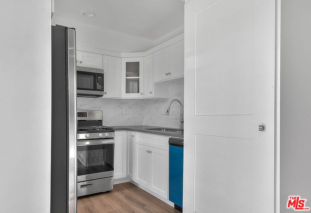 Interior, Kitchen, Marble Walls, Stainless Steel Appliances, Wood Texture Flooring