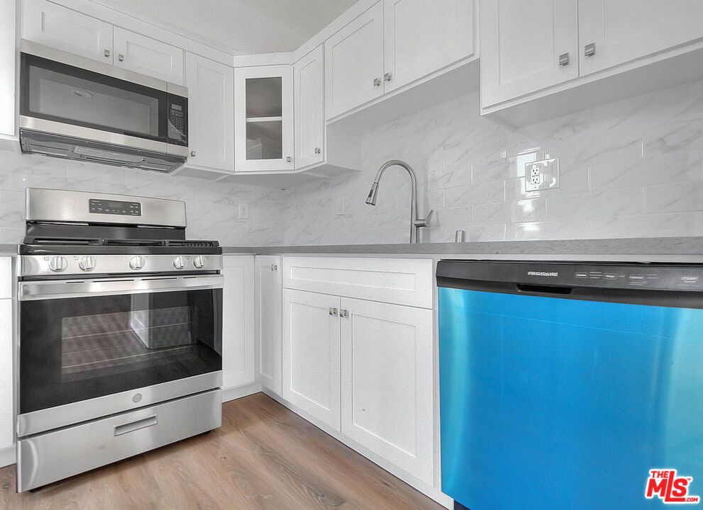 Interior, Kitchen, Marble Walls, Stainless Steel Appliances, Wood Texture Flooring