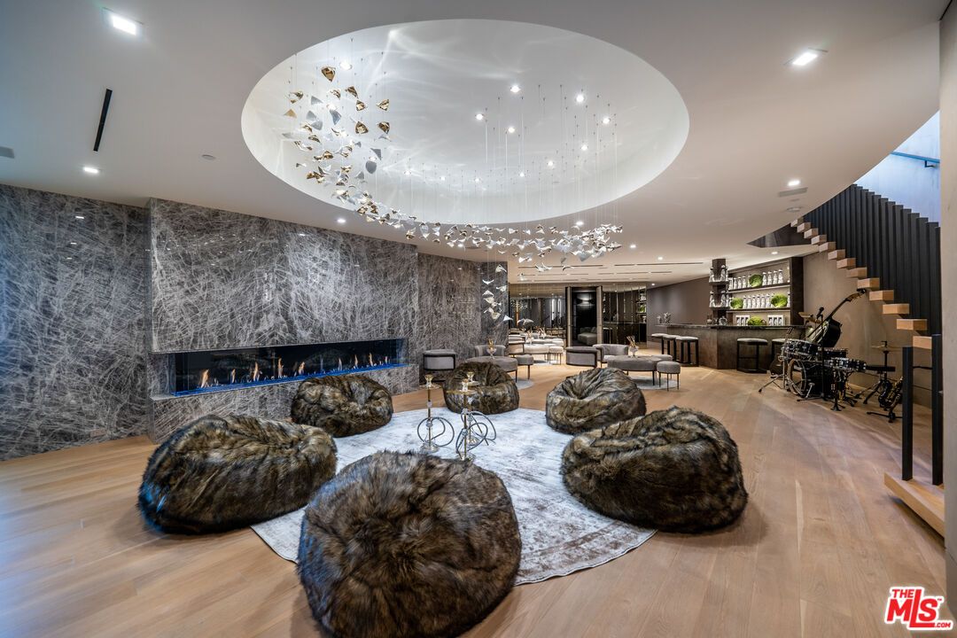 Fireplace, Interior, Living room, Marble Walls, Pendant Lights, Recessed Lighting, Wood Texture Flooring