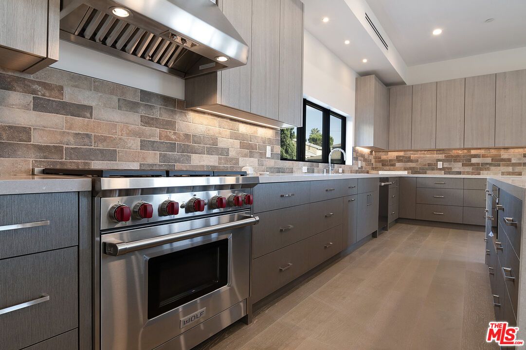 Interior, Kitchen, Recessed Lighting, Stainless Steel Appliances, Stone Walls, Wood Texture Flooring