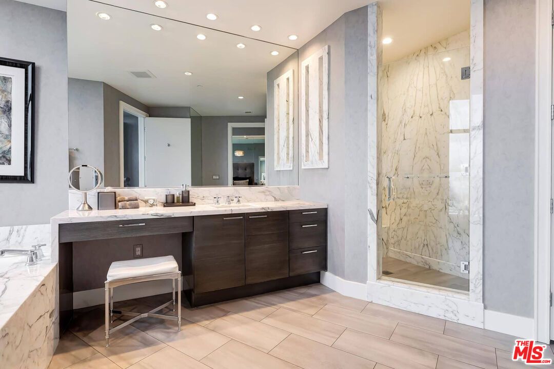 Bathroom, Dual Sink Vanities, Interior, Marble, Marble Walls, Recessed Lighting, Wood Texture Flooring