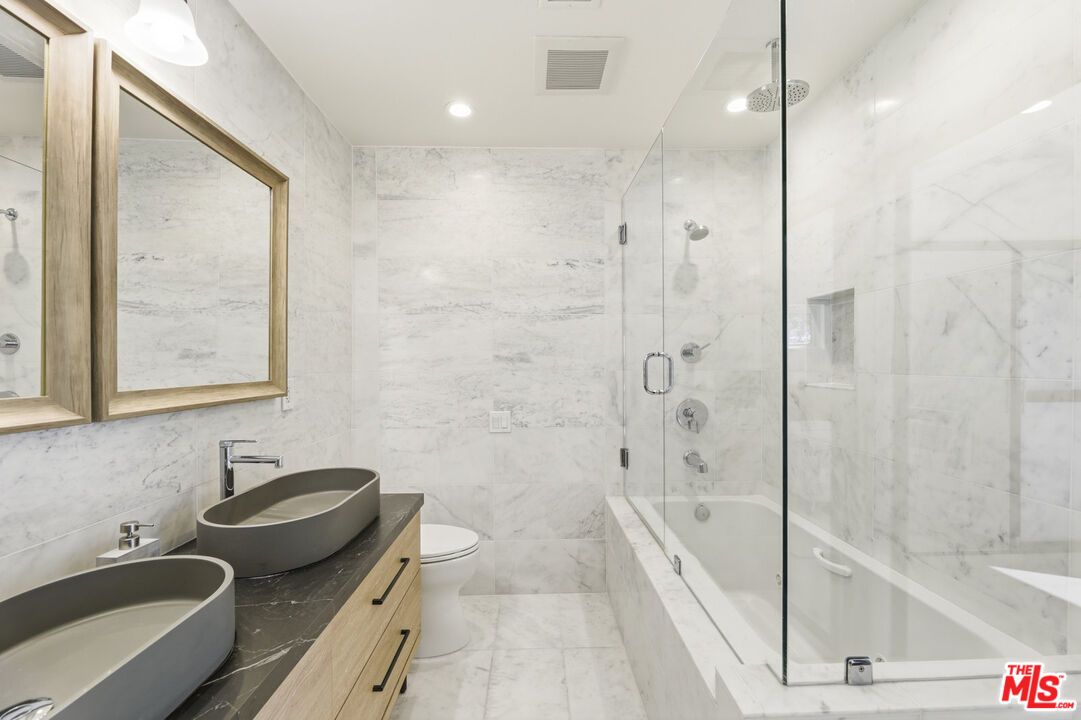 Bathroom, Dual Sink Vanities, Glass Shower, Interior, Marble, Marble Walls, Recessed Lighting