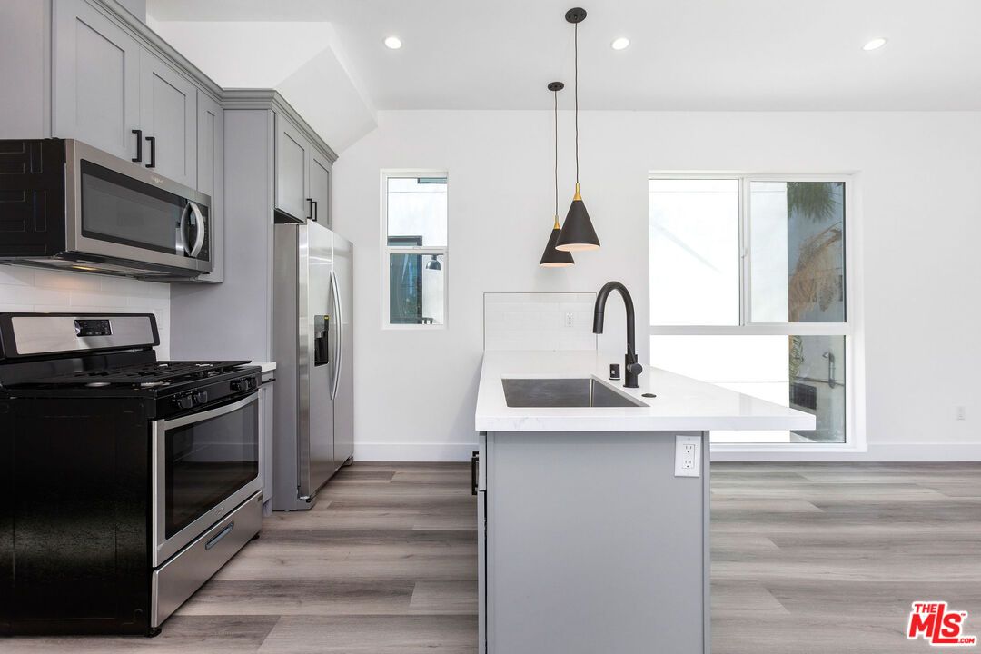 Interior, Kitchen, Pendant Lights, Recessed Lighting, Stainless Steel Appliances, Wood Texture Flooring