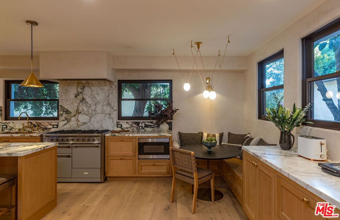 Interior, Kitchen, Marble Walls, Pendant Lights, Stainless Steel Appliances, Wood Texture Flooring