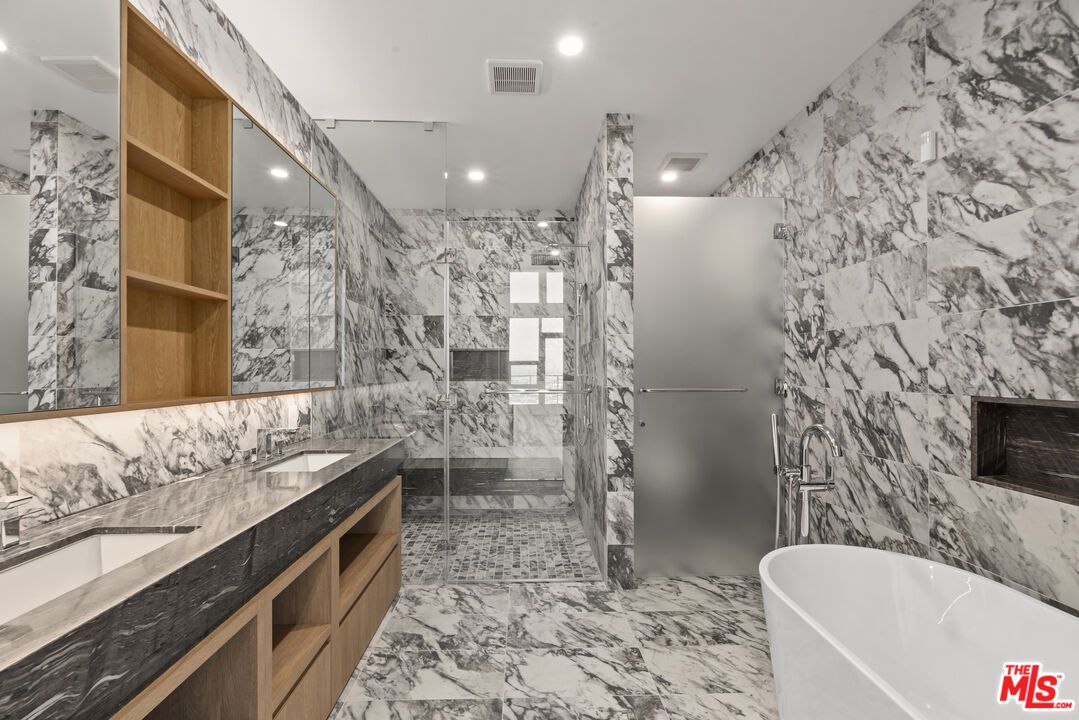 Bathroom, Dual Sink Vanities, Free Standing Baths, Glass Shower, Interior, Marble, Marble Walls, Recessed Lighting
