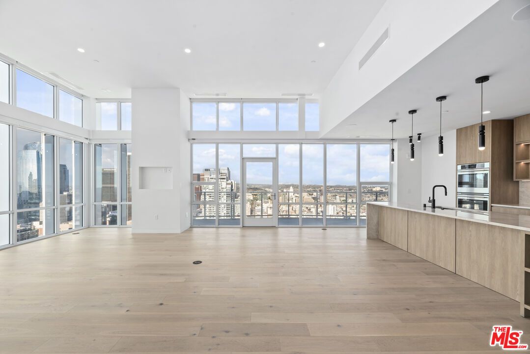 Empty room, Interior, Kitchen, Pendant Lights, Recessed Lighting, Stainless Steel Appliances, Wood Texture Flooring
