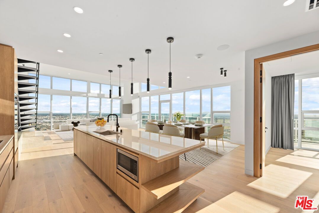 Dining room, Interior, Kitchen, Living room, Pendant Lights, Recessed Lighting, Stainless Steel Appliances, Water, Wood Texture Flooring