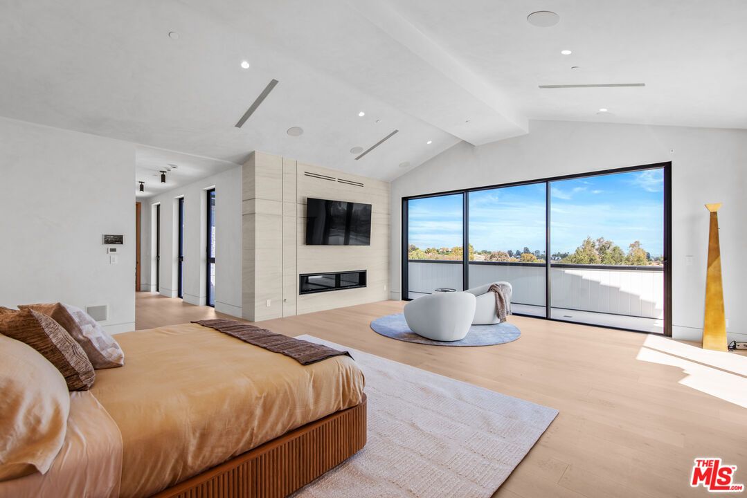 Bedroom, Fireplace, Interior, Recessed Lighting, Water, Wood Texture Flooring