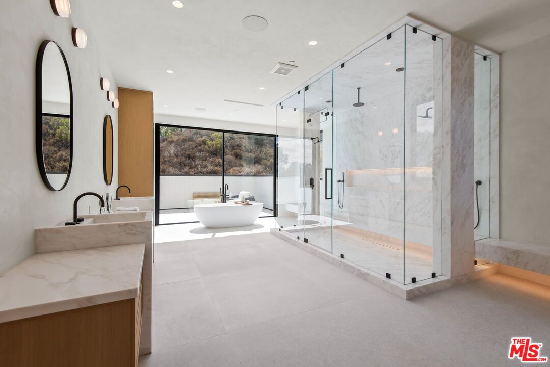 Bathroom, Dual Sink Vanities, Free Standing Baths, Glass Shower, Interior, Marble Walls, Recessed Lighting