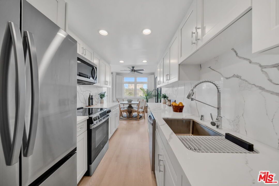 Dining room, Interior, Kitchen, Marble Walls, Recessed Lighting, Stainless Steel Appliances, Wood Texture Flooring