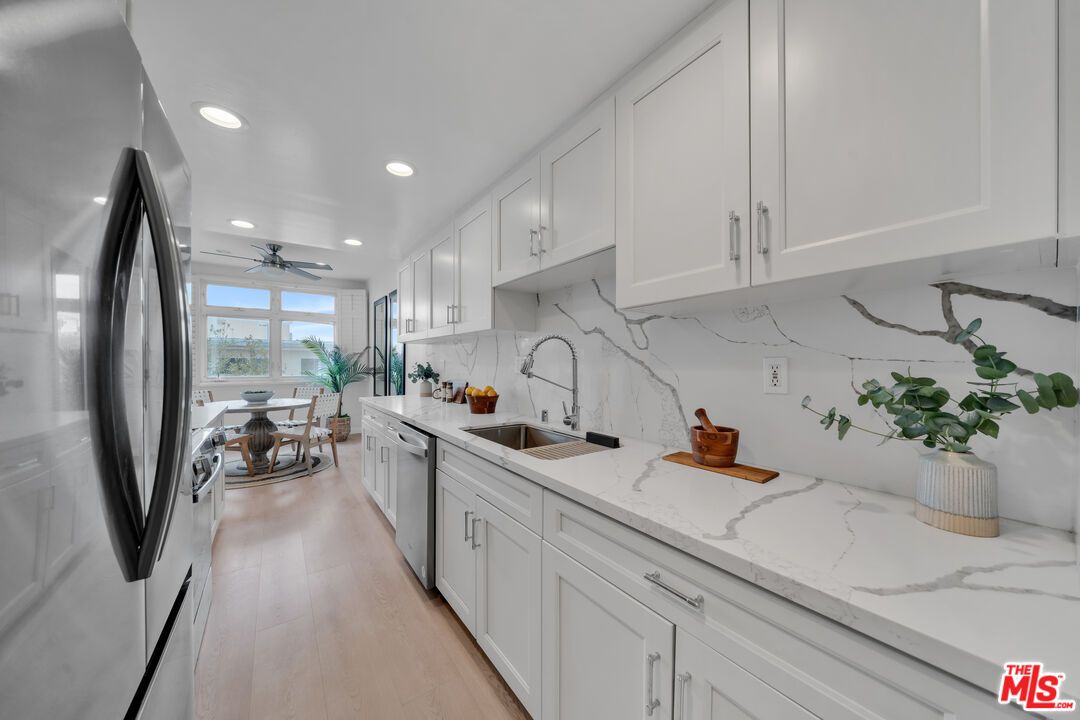 Dining room, Interior, Kitchen, Marble Walls, Recessed Lighting, Stainless Steel Appliances, Wood Texture Flooring