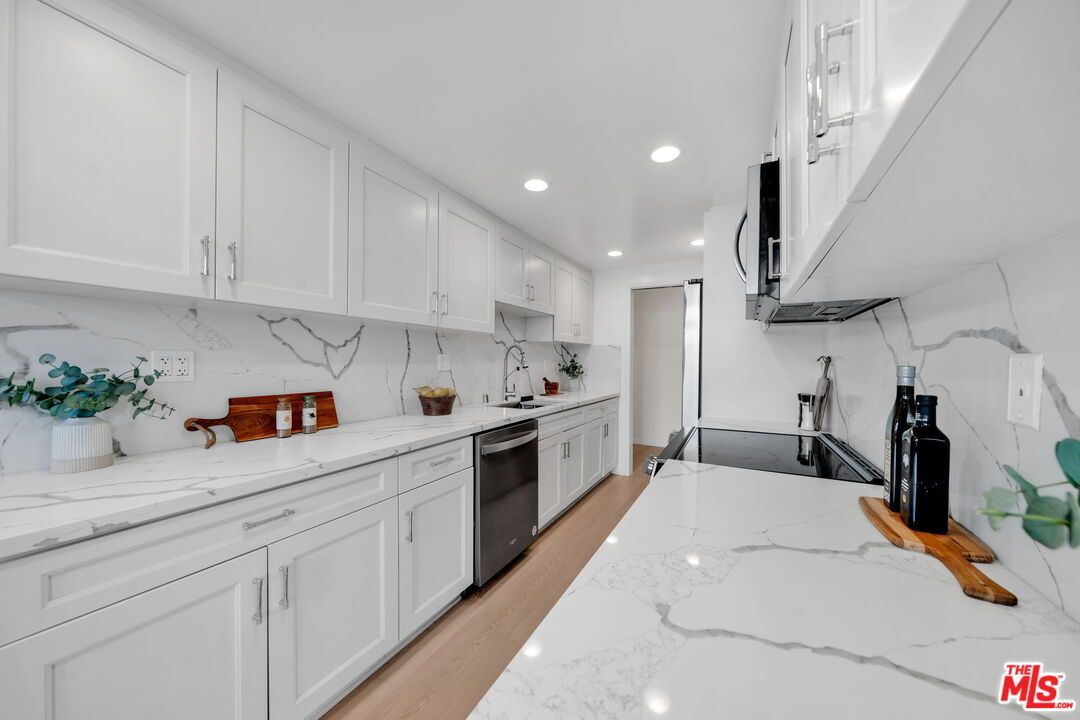 Interior, Kitchen, Marble Walls, Recessed Lighting, Stainless Steel Appliances, Wood Texture Flooring