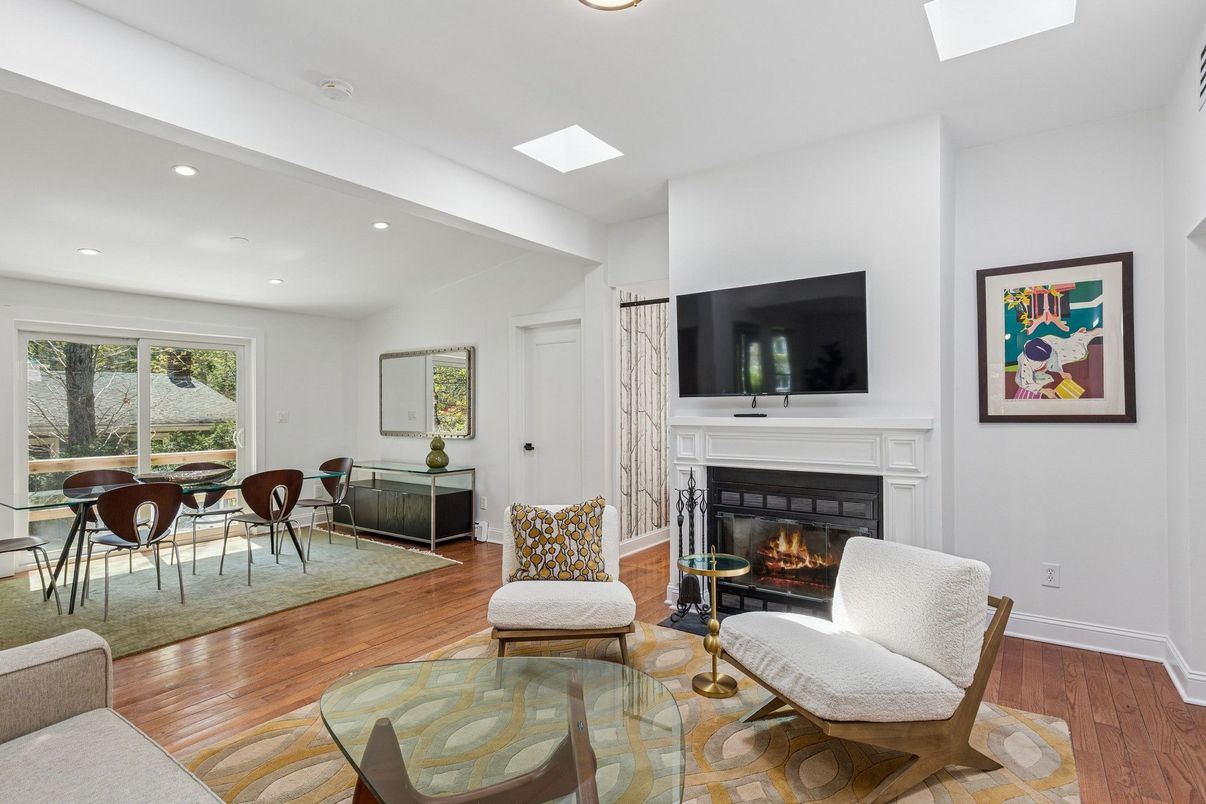 Dining room, Fireplace, Interior, Living room, Recessed Lighting, Wood Texture Flooring