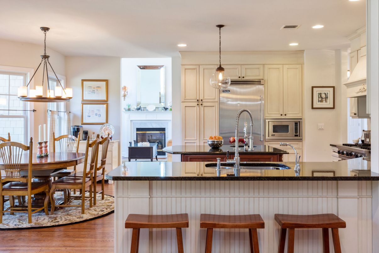 Chandelier, Dining room, Fireplace, Interior, Kitchen, Pendant Lights, Recessed Lighting, Stainless Steel Appliances, Wood Texture Flooring