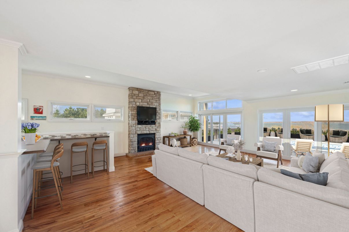 Fireplace, Interior, Living room, Recessed Lighting, Stone Walls, Wood Texture Flooring