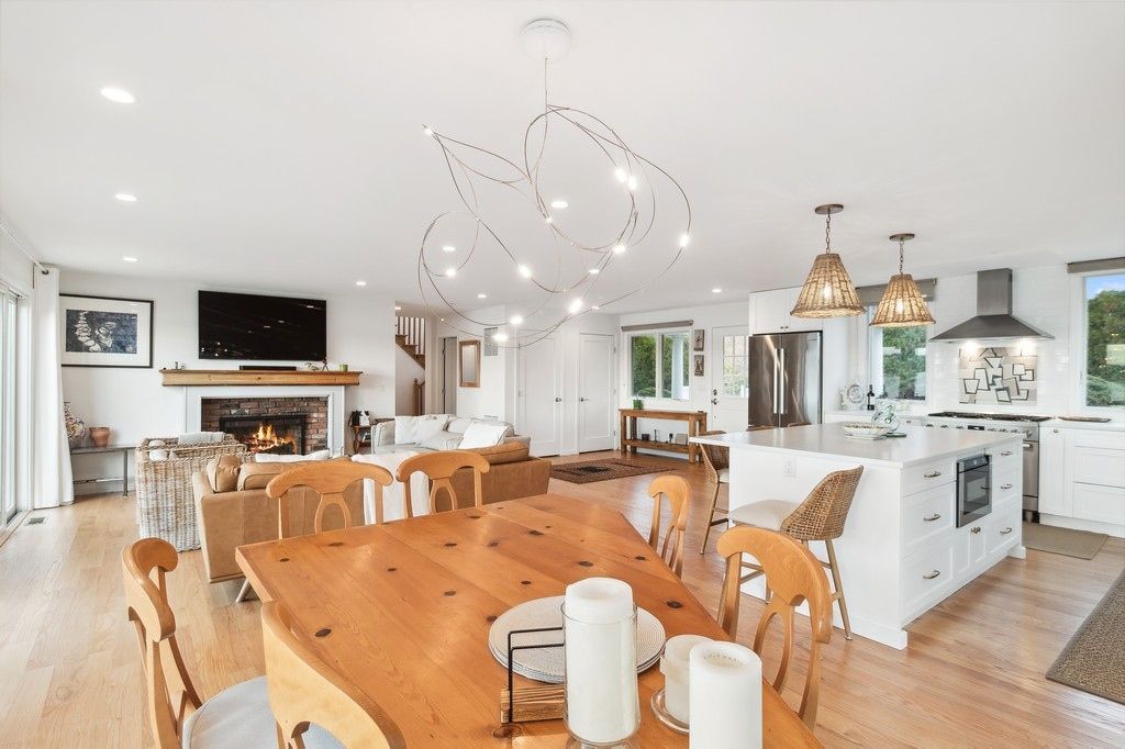 Dining room, Fireplace, Interior, Kitchen, Living room, Pendant Lights, Recessed Lighting, Stainless Steel Appliances, Wood Texture Flooring