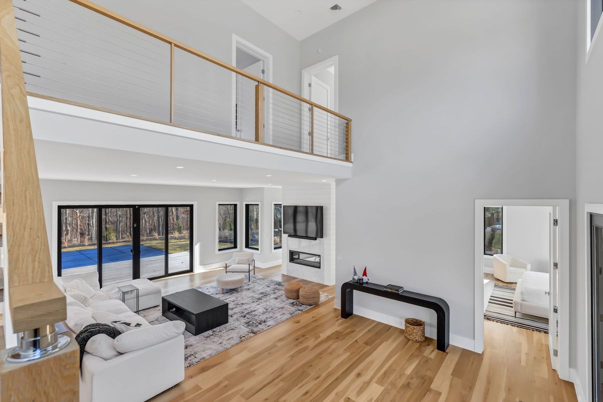 Fireplace, Interior, Living room, Recessed Lighting, Water, Wood Texture Flooring