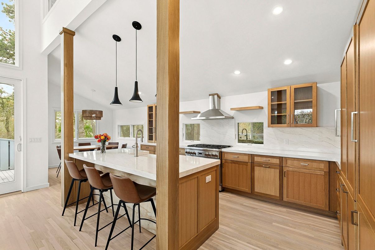 Interior, Kitchen, Marble Walls, Pendant Lights, Recessed Lighting, Stainless Steel Appliances, Wood Texture Flooring