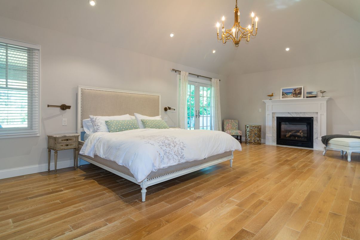 Bedroom, Chandelier, Fireplace, Interior, Recessed Lighting, Wood Texture Flooring
