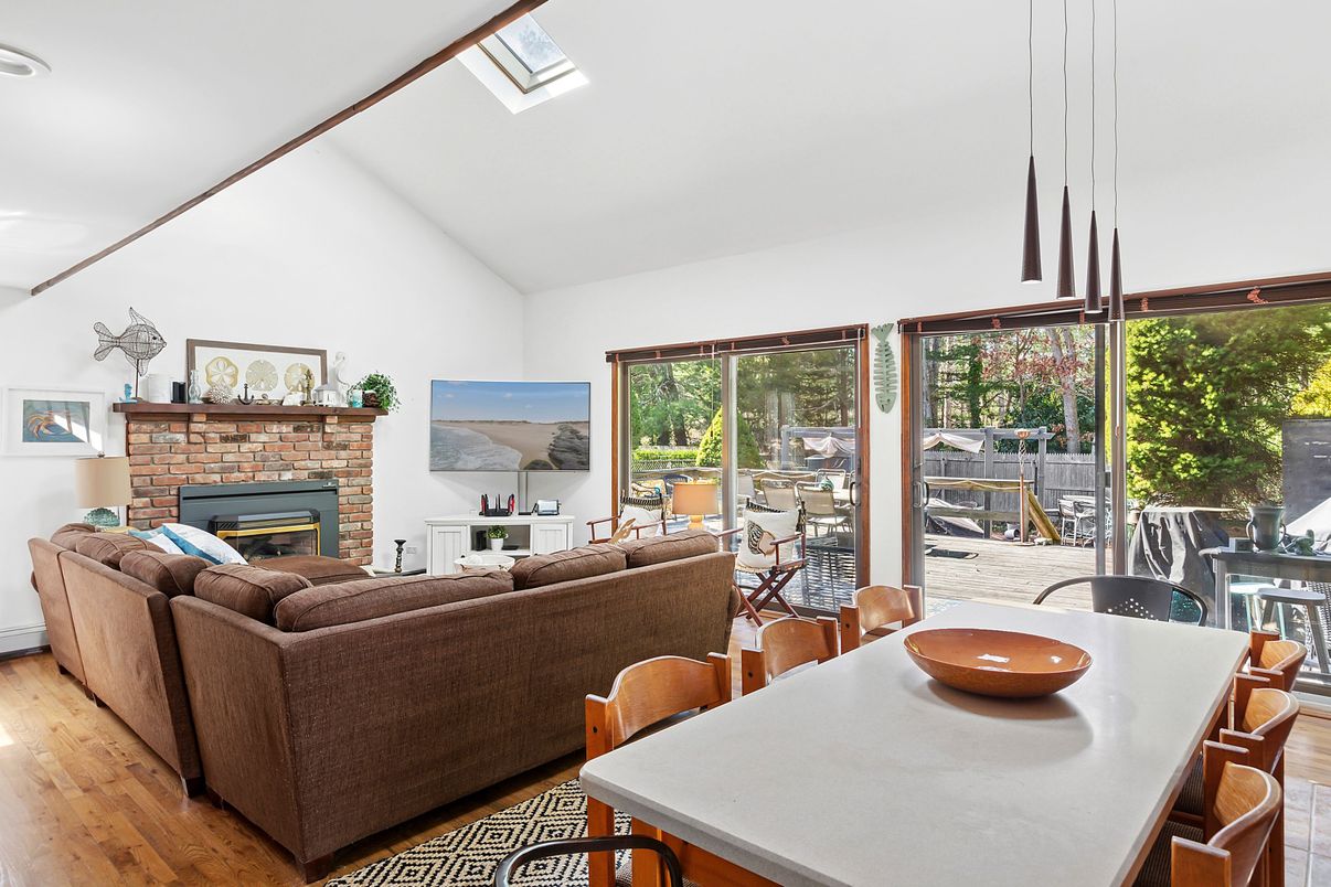 Dining room, Fireplace, Interior, Living room, Recessed Lighting, Wood Texture Flooring