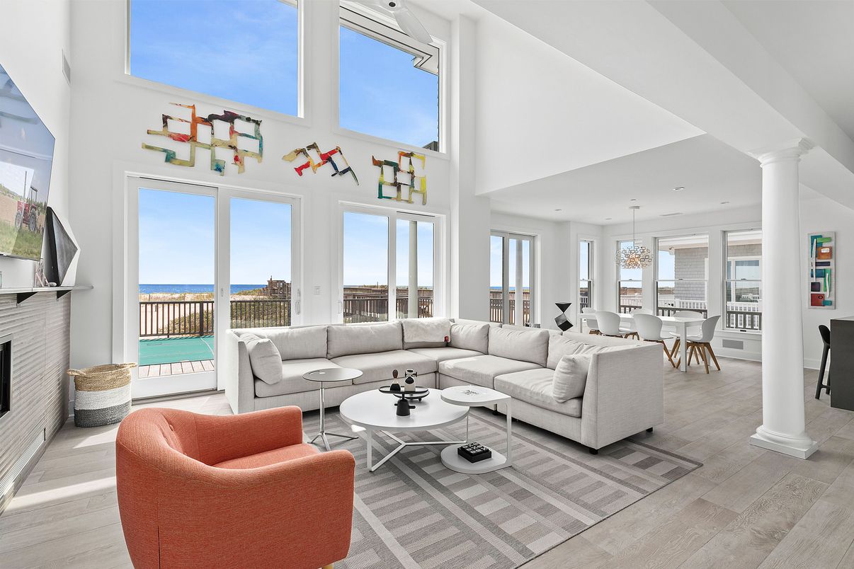 Dining room, Fireplace, Interior, Living room, Pendant Lights, Recessed Lighting, Water, Wood Texture Flooring