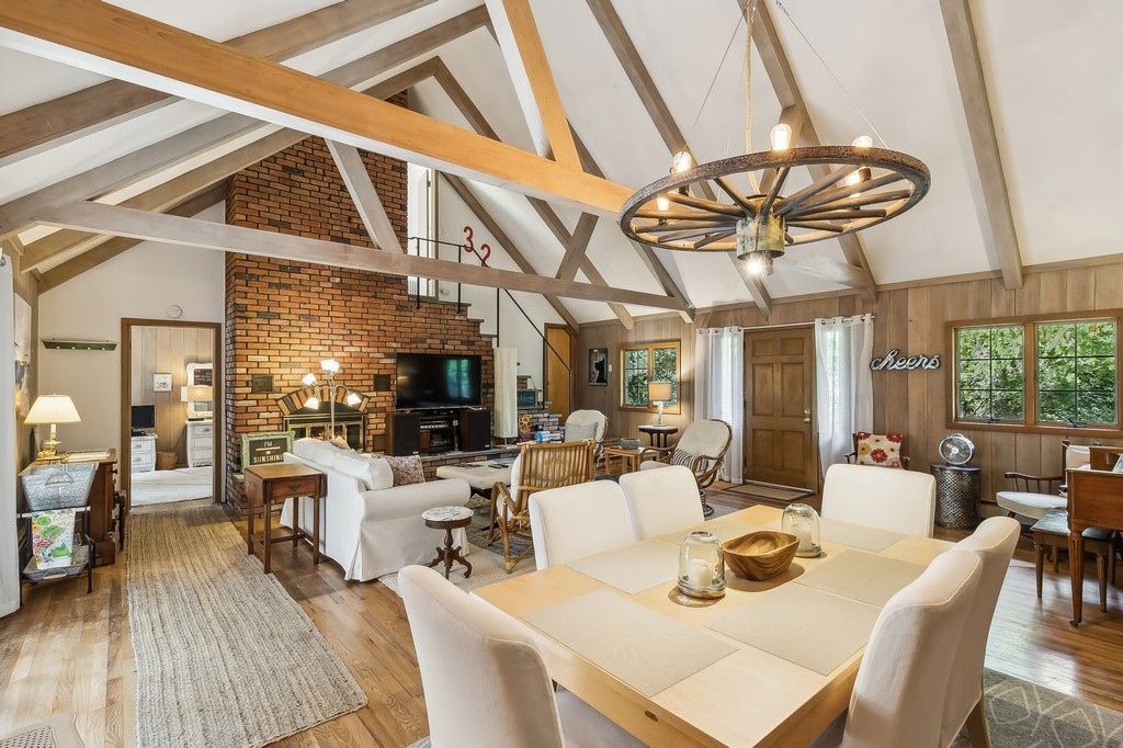 Chandelier, Dining room, Fireplace, Interior, Living room, Stone Walls, Wooden Beams, Wood Texture Flooring