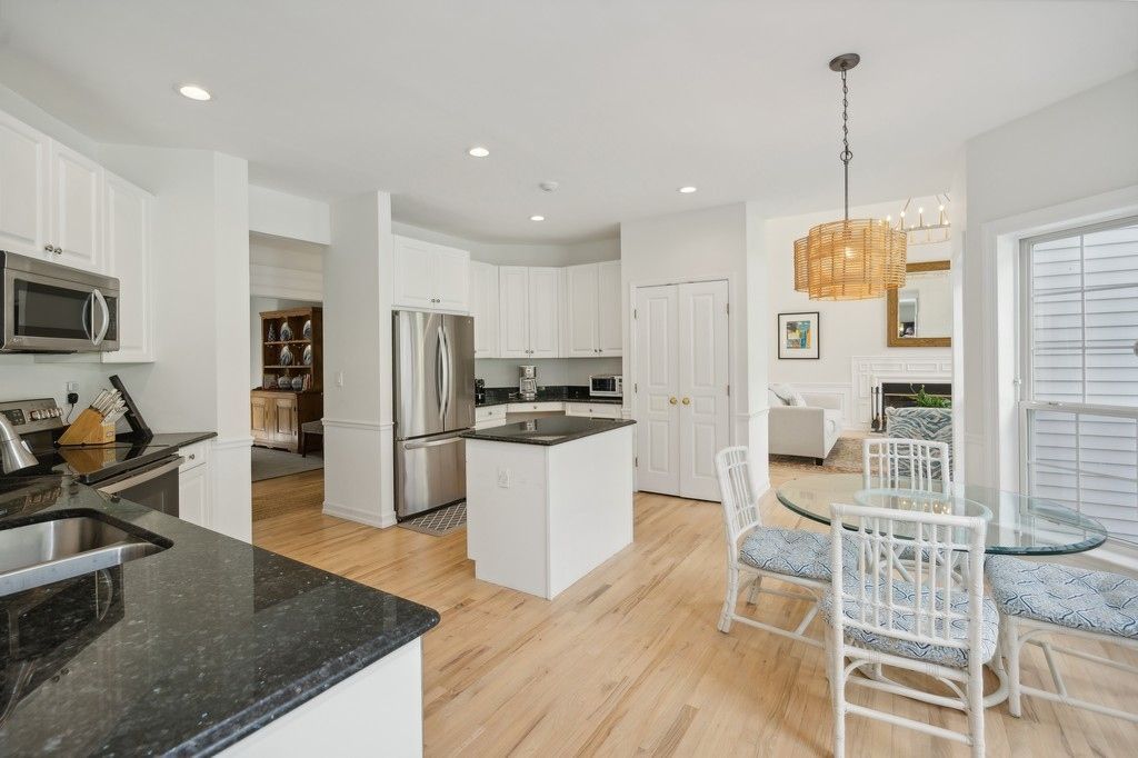 Chandelier, Dining room, Fireplace, Interior, Kitchen, Pendant Lights, Recessed Lighting, Stainless Steel Appliances, Wood Texture Flooring