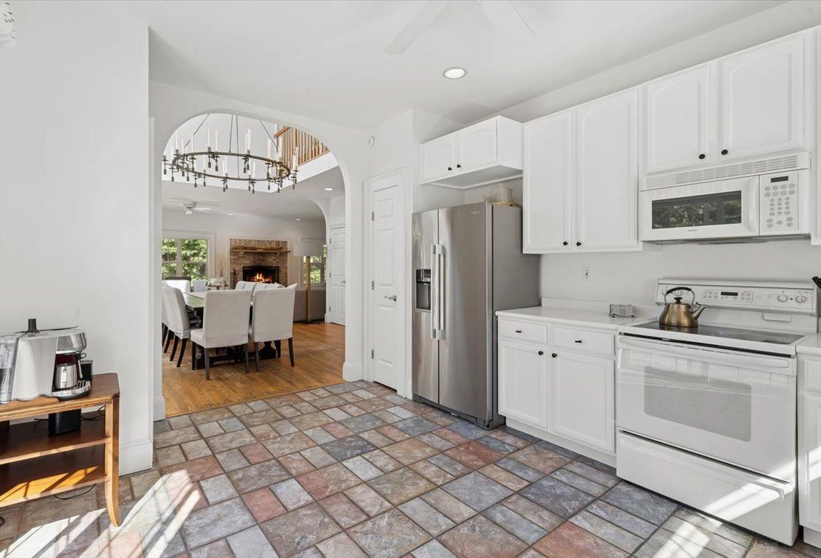 Chandelier, Dining room, Fireplace, Interior, Kitchen, Recessed Lighting, Stainless Steel Appliances