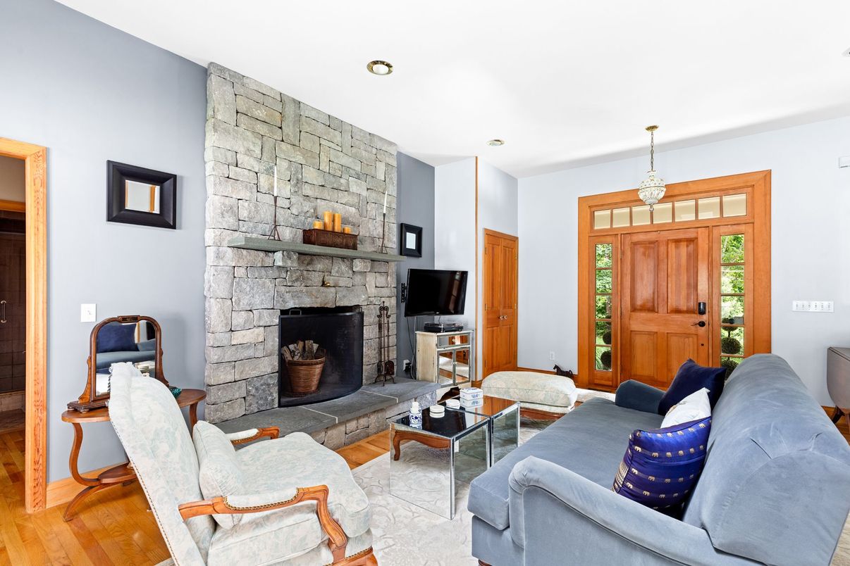 Fireplace, Interior, Living room, Pendant Lights, Recessed Lighting, Stone Walls, Wood Texture Flooring