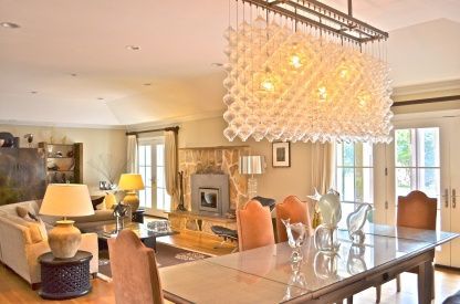 Chandelier, Dining room, Fireplace, Interior, Living room, Pendant Lights, Recessed Lighting, Wood Texture Flooring