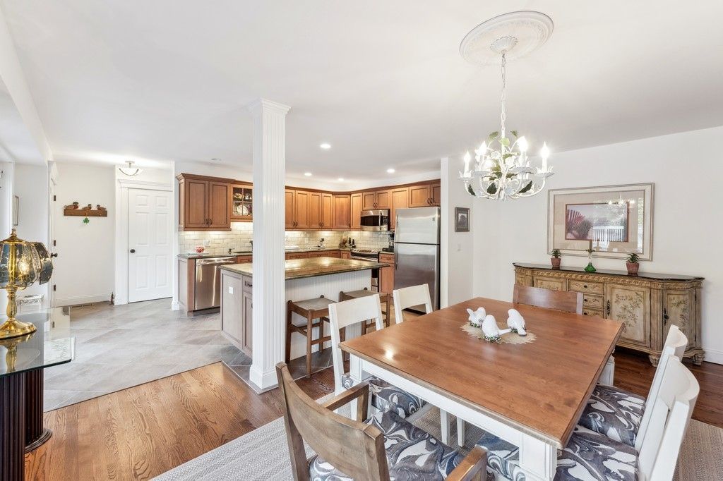 Chandelier, Dining room, Interior, Kitchen, Recessed Lighting, Stainless Steel Appliances, Wood Texture Flooring