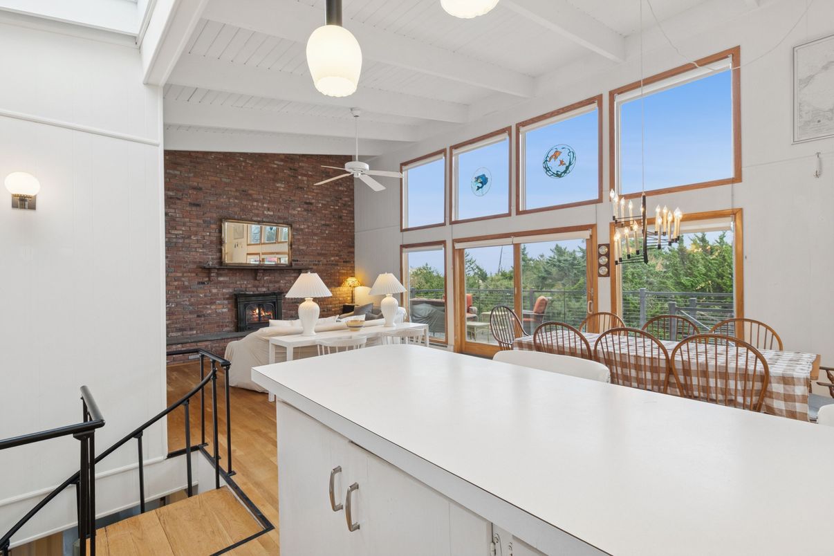 Chandelier, Dining room, Fireplace, Interior, Living room, Stone Walls, Wood Texture Flooring