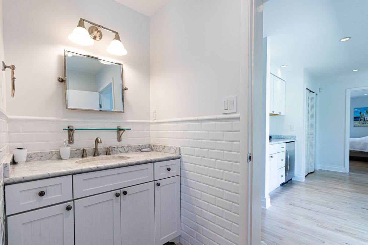 Bathroom, Interior, Recessed Lighting, Washer, Wood Texture Flooring