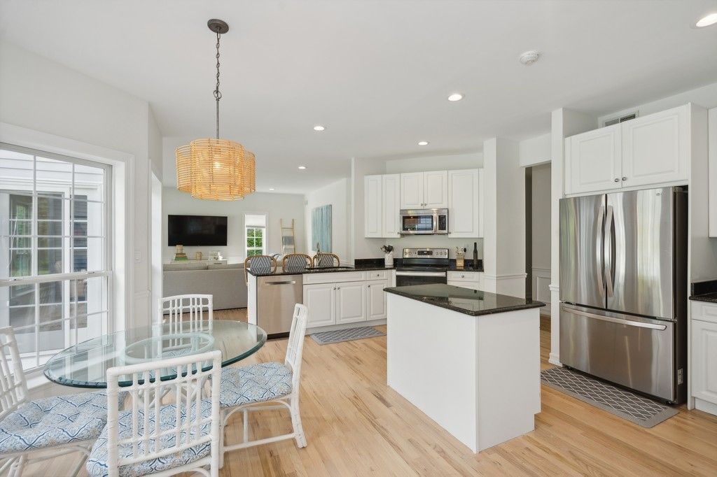 Dining room, Interior, Kitchen, Pendant Lights, Recessed Lighting, Stainless Steel Appliances, Wood Texture Flooring