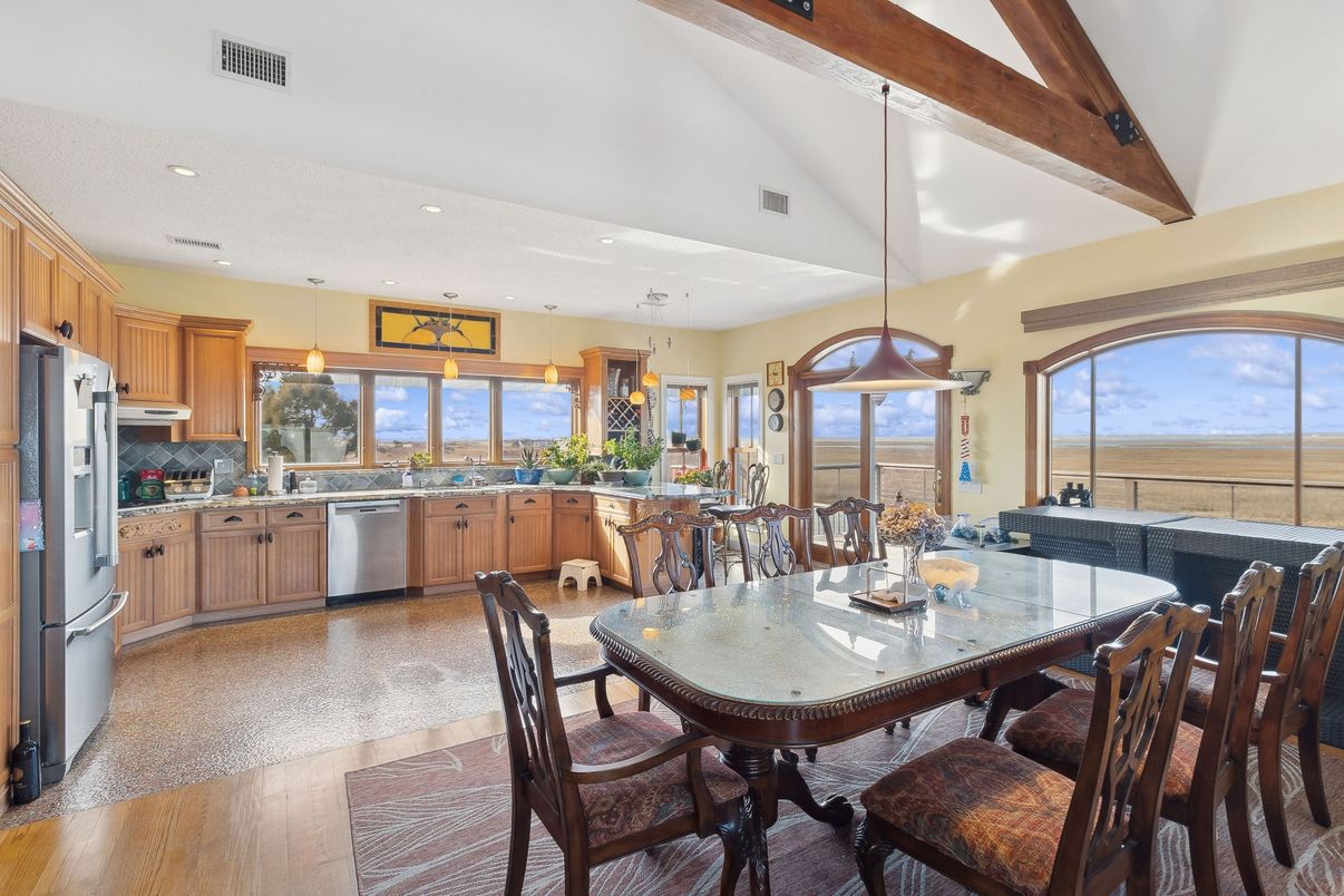 Dining room, Interior, Kitchen, Pendant Lights, Recessed Lighting, Stainless Steel Appliances, Water, Wooden Beams, Wood Texture Flooring