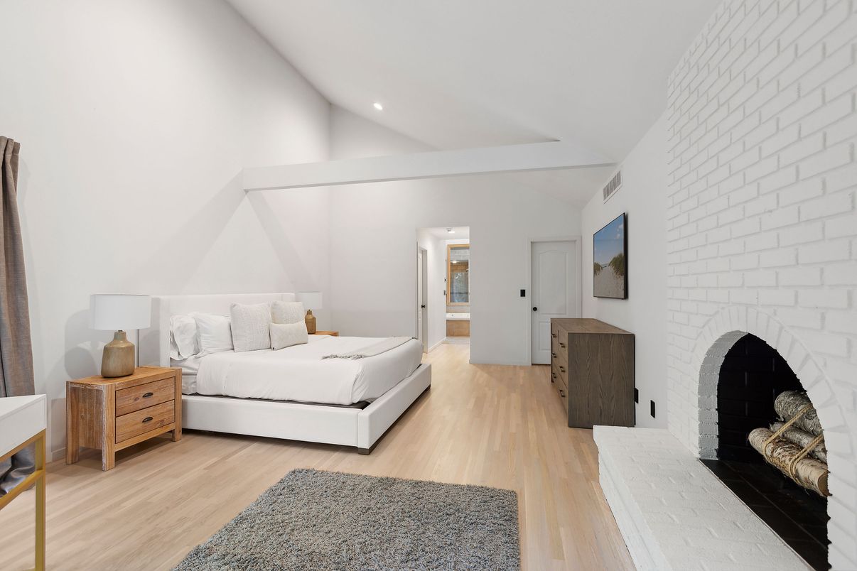 Bedroom, Fireplace, Interior, Recessed Lighting, Stone Walls, Wood Texture Flooring