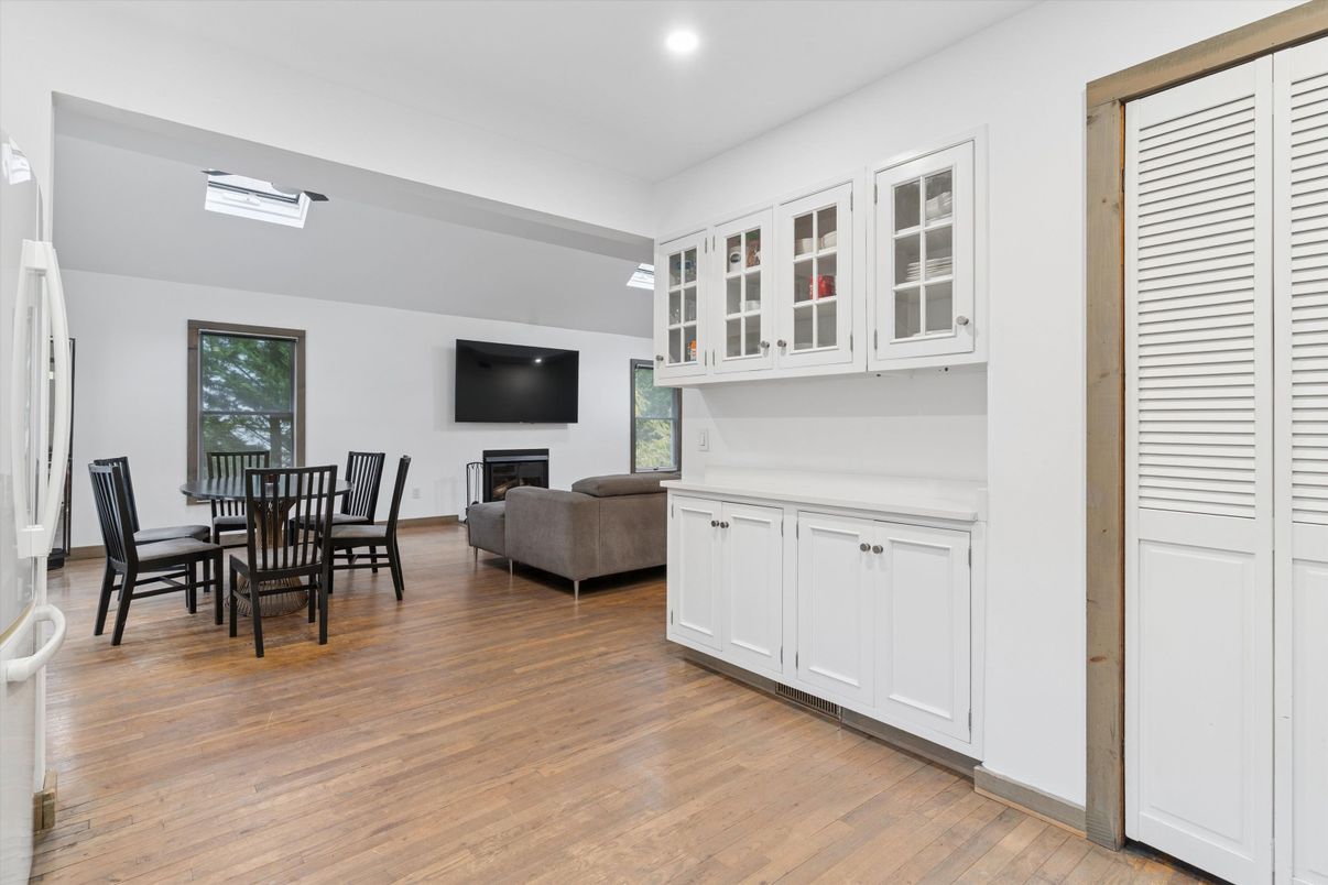 Dining room, Fireplace, Interior, Living room, Recessed Lighting, Wood Texture Flooring