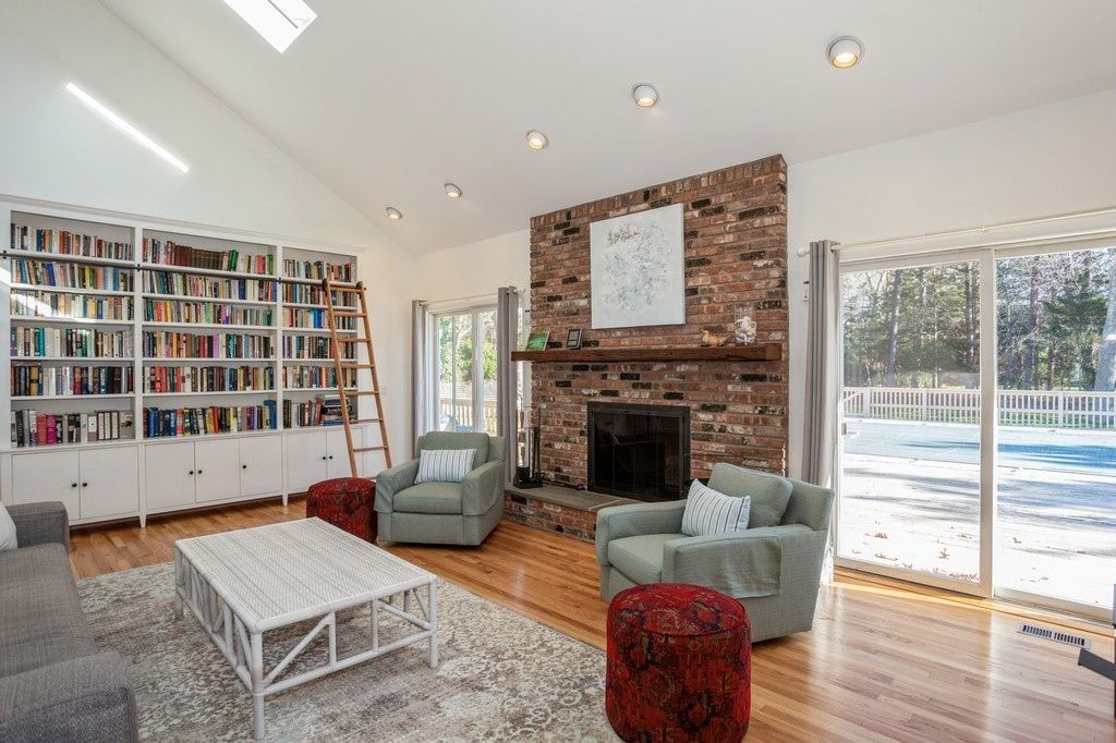 Fireplace, Interior, Living room, Recessed Lighting, Stone Walls, Wood Texture Flooring