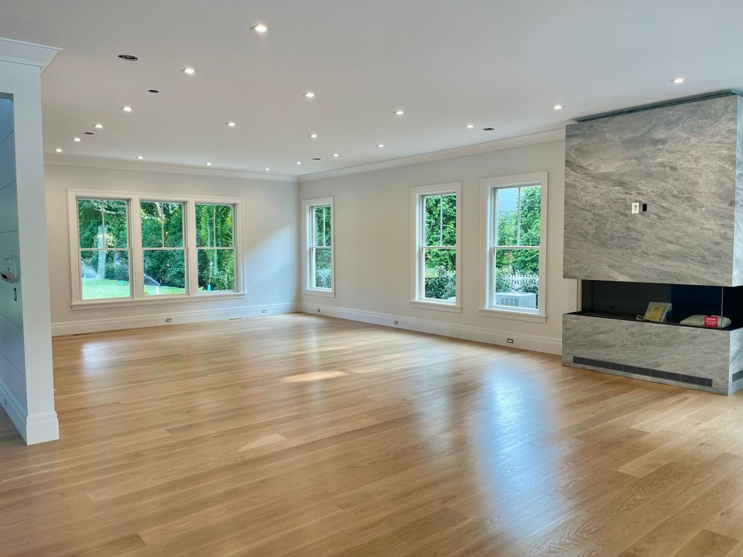 Empty room, Fireplace, Interior, Marble Walls, Recessed Lighting, Wood Texture Flooring